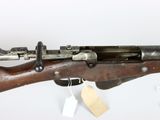 an old machine gun with a wooden barrel and a wooden handle