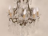 a chandelier that has five lights on it