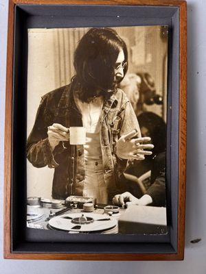 a picture of a woman holding a cup of coffee