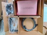 a box of wires and a pink bag in it