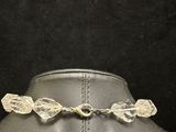 a close up of a necklace on a mannequin mannequin