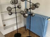 an image of a living room with a radiator and a lamp