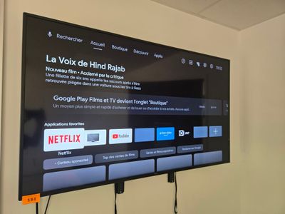 a flat screen tv mounted on the wall in a room
