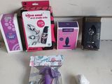 a box of toothbrushes, a toothpaste, and other items on a table