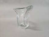 a glass vase that is sitting on a table
