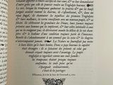 an open book with a drawing of a butterfly on it