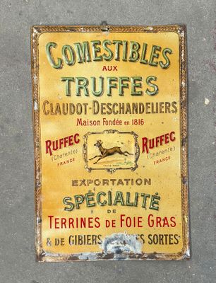 a sign on the side of a building that says comestibles and truffes