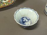 a blue and white bowl with a picture of a man on it