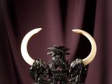 an image of a statue of a bull with horns on a table