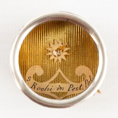 a silver and gold ring with a picture of a star on it