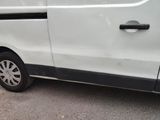 a white van that is parked on the side of the road
