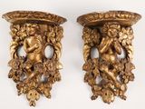 two gold colored vases with cherenshes on them