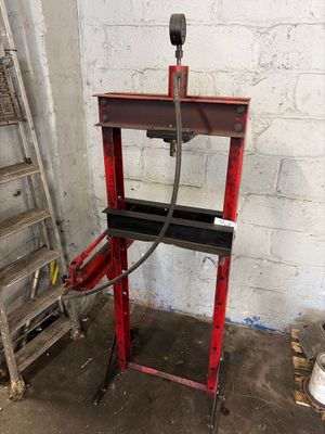 an image of a red machine in a garage