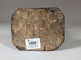 a piece of wood that has a tag on it
