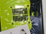 a green and black box with a black and white picture
