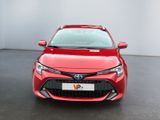 the front of a red toyota corollant parked in a room