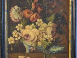 painting of flowers in a vase on a table in a room