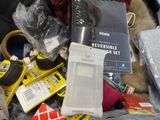 a pile of items sitting on top of a suitcase