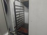 an image of a kitchen with a rack of food in it