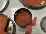 four pans of cake sitting on a table next to each other