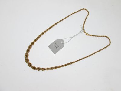 a close up of a gold chain with a tag on it