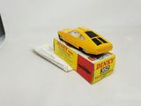 a yellow toy car sitting on top of a box