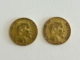 two gold sovereigns, one with the head of a man and one with a woman