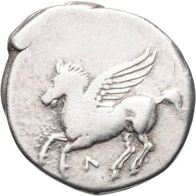 a close up of a silver coin with a horse on it