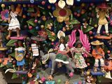 many figurines that are on display on a shelf