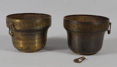 pair of antique brass vases with handles and handles on a white background