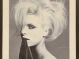 a black and white photo of a woman with blonde hair