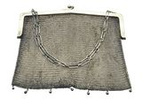 an antique silver mesh purse with chain and clasps