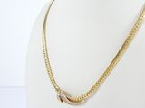 a close up of a gold necklace on a mannequin mannequin mannequin mannequin mannequin mannequin mannequin manne