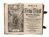 un vieux livre comportant une illustration en noir et blanc représentant une scène biblique