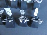 a lot of rings that are on display on the table
