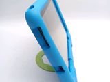 a small blue tablet computer sitting on top of a green stand