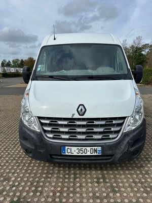 a white van parked in a parking lot next to a parking lot
