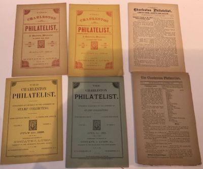 six old philaelist books on a white table