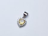 un gros plan d'un pendentif en diamants jaunes et blancs sur fond blanc