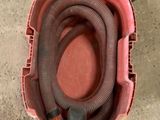an image of a vacuum cleaner with a hose in it