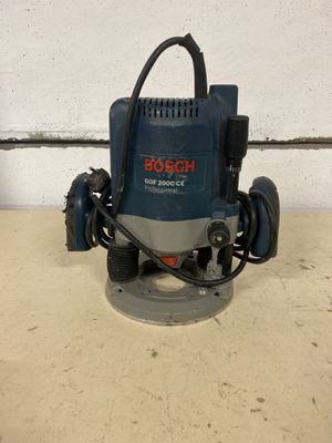 a close up of a bosch router on a table in front of a wall