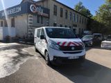a white van that is parked in front of a building