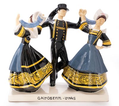 two figurines of a man and a woman dancing