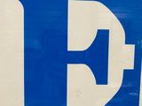 a blue and white sign with the word love on it