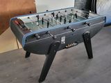 a foosball table in the corner of a room