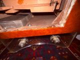 a wooden table with a metal object on it
