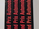 four books that are on a shelf on top of a table