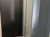 a bathroom with a toilet and a shower stall in it
