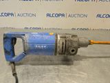 an image of a drill that is sitting on the floor