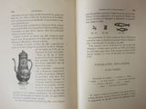 an open book with a drawing of a teapot on it